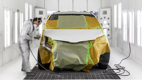 Collision Center Technician Painting a Vehicle | Koons Annapolis Toyota in Annapolis MD
